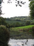 SX09635 Sunny hills reflected in Monmouthshire and Brecon Canal.jpg